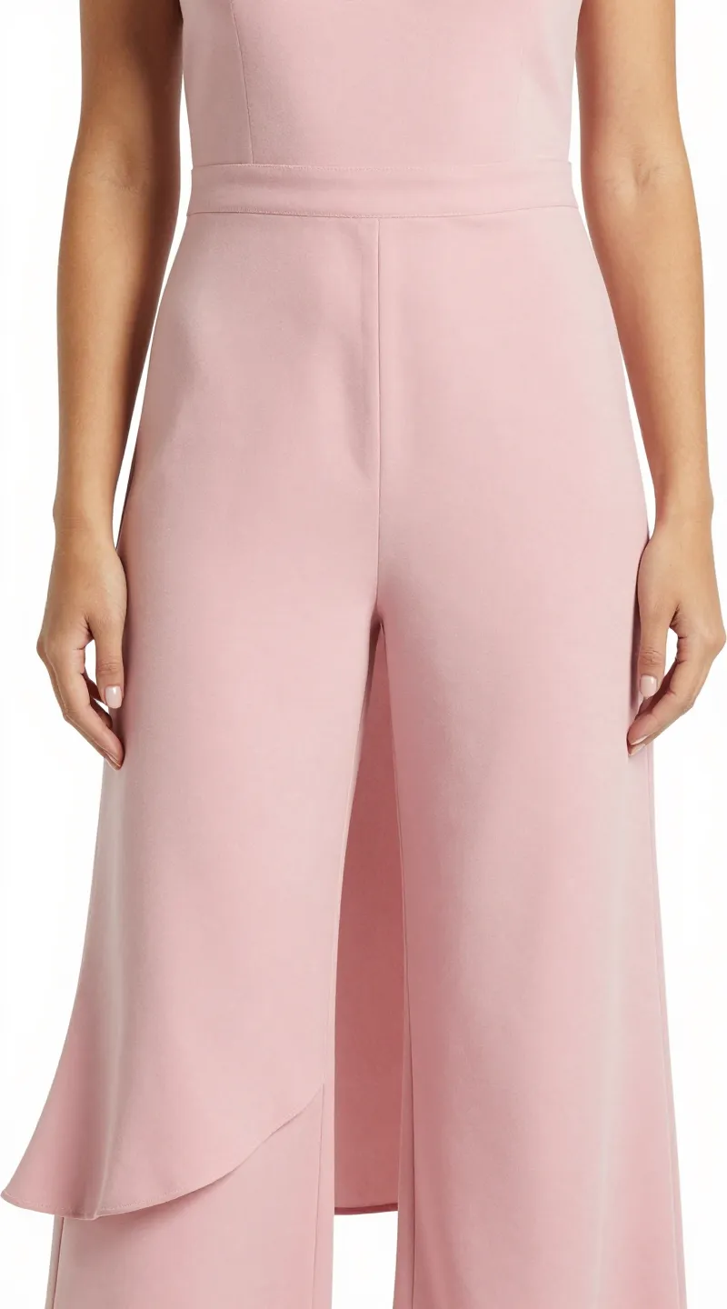 **Detailed shot of a millennial pink asymmetrical hem jumpsuit**
