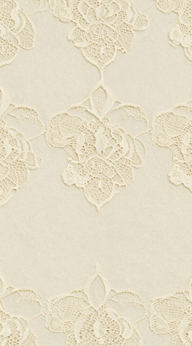 **Detailed shot of ivory lace overlay fabric**