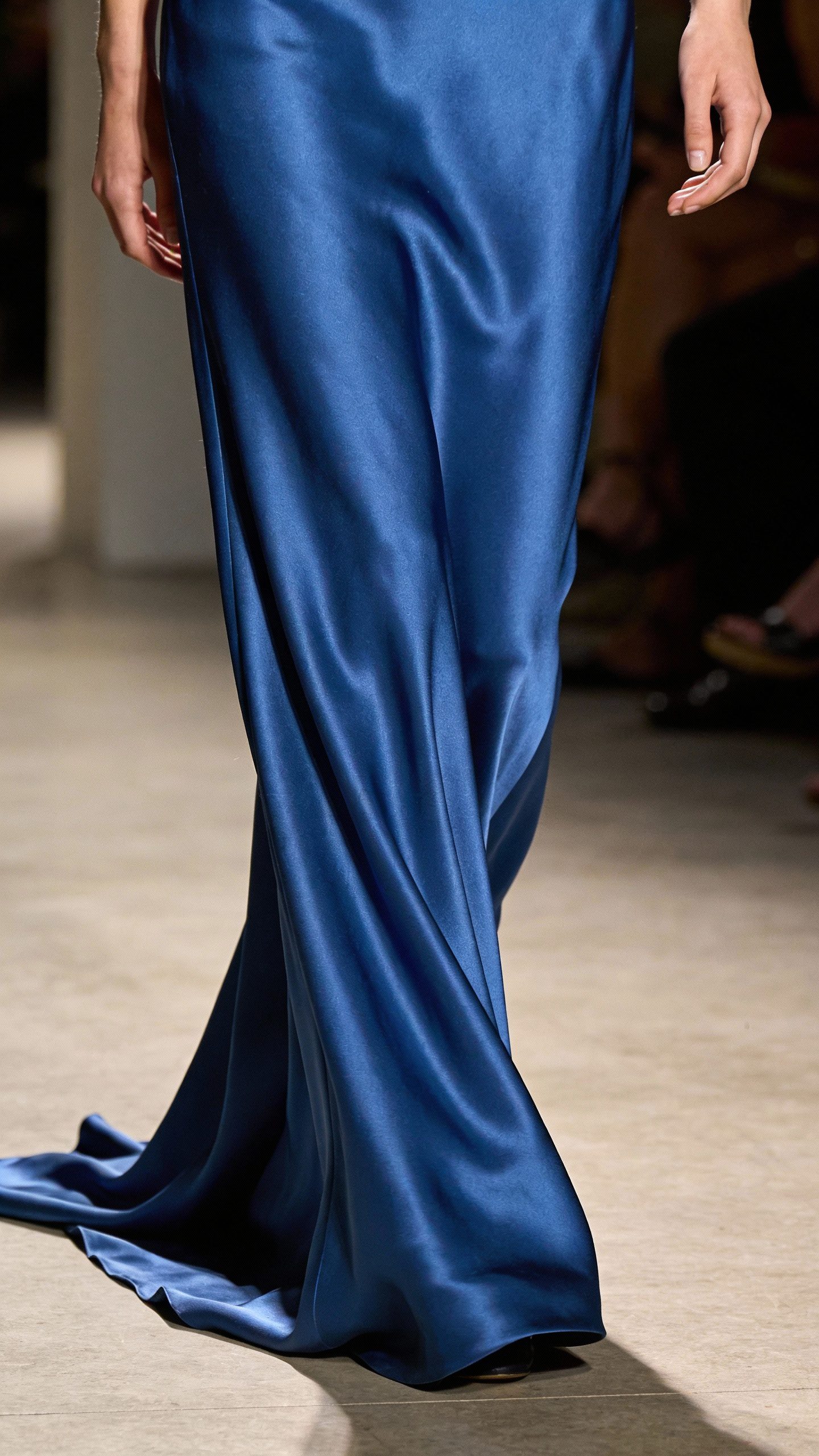 **Closeup of a sapphire blue satin floor-length gown**