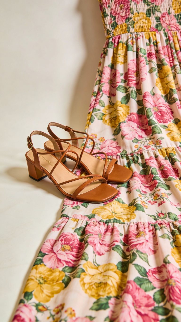 **Detailed shot of floral maxi dress with strappy sandals**