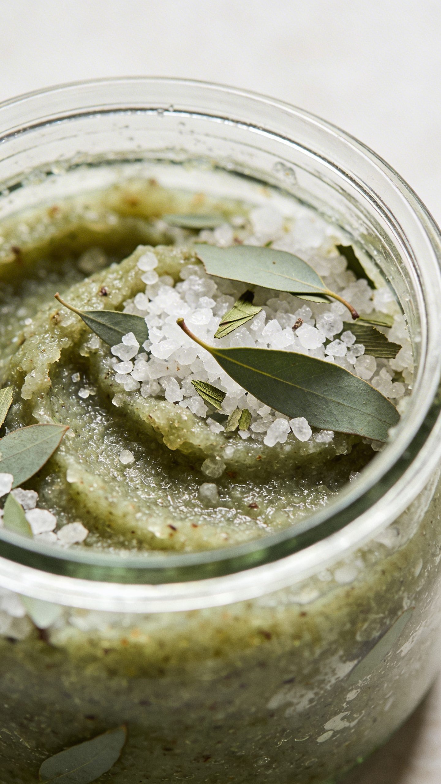 closeup of eucalyptus sea salt scrub in glass jar
