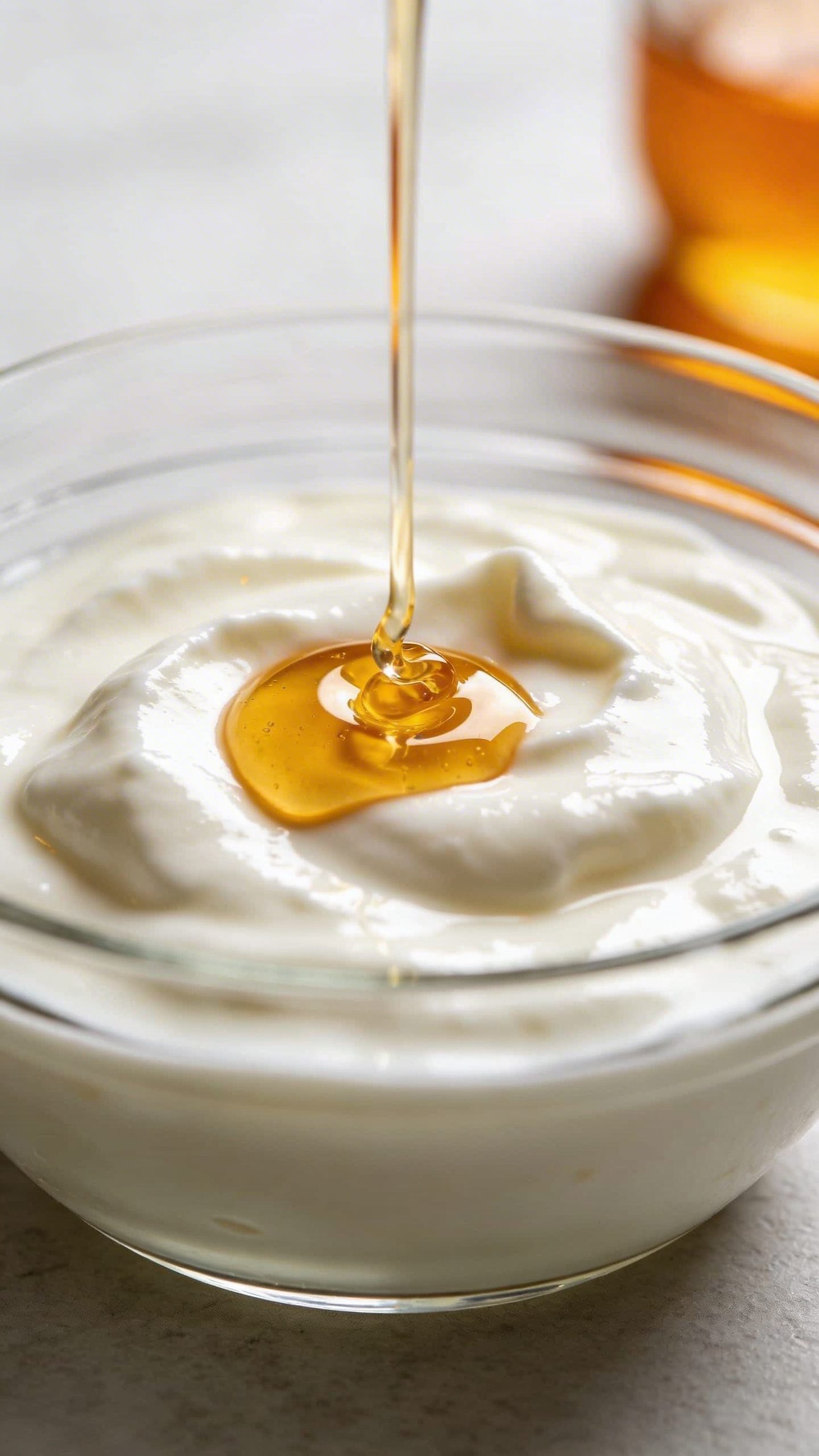 closeup glass bowl of yogurt honey face mask mixture